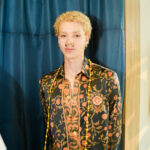 Nacido en Bogotá, Colombia, Camilo Figueroa  es un joven que pertenece a una generación que no pidió permiso para crear.  
Desde sus inicios, su sensibilidad estuvo marcada por el arte multimedia y una atracción inevitable hacia el cine y los lenguajes audiovisuales. Consolidando su universo creativo, entendió algo clave: el arte también se construye en el mundo real. Así, entre emprendimientos locales y pequeñas empresas, comenzó a moldear una visión que pronto rompería los límites de lo convencional.

Su primer gran movimiento llegó junto a la empresa de vehículos Francesa Renault, en una era donde las redes sociales apenas despertaban.   Mientras el mundo aprendía a usarlas, Camilo ya las reinterpretaba. No creaba contenido: creaba identidad. 
Ese impulso lo llevó a colaborar con marcas como Bavaria, Pernod Ricard, Postobon, Corona, y a trabajar con medios internacionales como VICE, EXCLAMA y The Hollywood Reporter, donde su mirada comenzó a posicionarse como una firma visual reconocible: impactante, moderna y deliberadamente atrevida. 
Su lente ha cruzado fronteras capturando modelos internacionales, ferias de moda como Bogotá Fashion Week y Colombiamoda, y producciones en escenarios como Italia y México, donde consolidó una estética que dialoga entre el lujo contemporáneo y la narrativa visual artistica.  
Fotografo del DJ internacional Claptone, del sello Defected Records, acompañándolo en presentaciones en Colombia, México y escenarios globales como Zamna en Tulum. De ese encuentro surgió también una portada para el Ibiza Radio Show, una emisora emblemática de la isla Española marcando un hito en su proyección internacional. 
Cada imagen de Camilo desafía lo esperado. Hay una intención estética clara: romper el esquema tradicional e introducir una chispa de lujo que transforma cada fotografía en una pieza digna de exhibición.
Sus obras no se consumen. Se coleccionan. 
Tras un viaje decisivo a Italia, comprendió el valor del papel en una era dominada por lo digital. Fue entonces cuando fundó 24PRINTS, un proyecto enfocado en la materialización del arte fotográfico: libros, cuadros y piezas impresas que elevan la imagen a objeto tangible. Su trabajo ha sido llevado a modelos, agencias, deportistas incluyendo el polo, marcas, empresas y figuras públicas, construyendo colecciones valoradas en millones de pesos.
Más que clientes, construye una comunidad.  Sus clientes entienden el peso, la permanencia y el prestigio de poseer una obra suya.
Hoy, como estudiante de cine y televisión, Camilo expande su lenguaje hacia nuevas dimensiones, explorando el audiovisual y la inteligencia artificial como herramientas para redefinir la creación contemporánea.